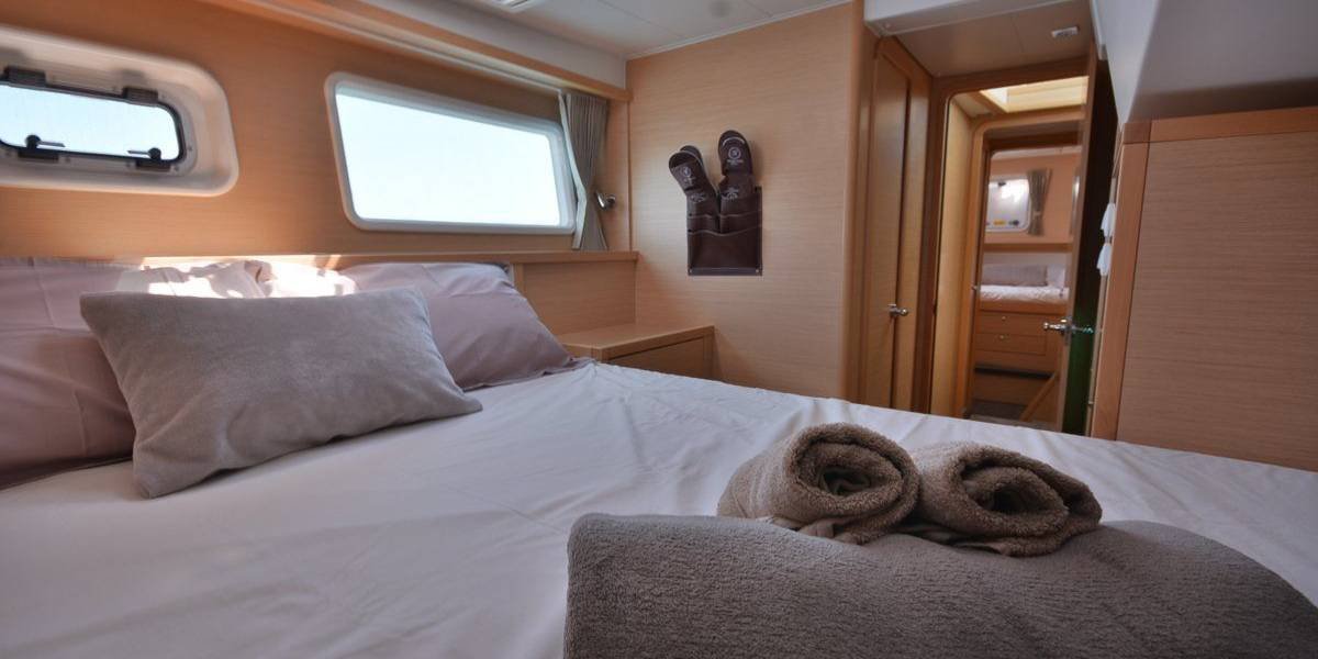 Private cabin bedroom aboard the Nikaia Yachts catamaran in Cannes